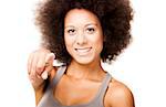 Happy Afro-American young woman isolated on white looking and pointing to the camera