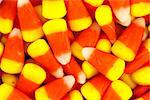 Closeup pile of colorful Halloween candy corn .