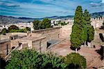 Courtyard of a Gibralfaro fortress (Alcazaba de Malaga) and view of Malaga city. Spain