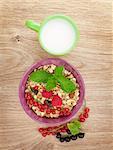 Healthy breakfast with muesli and milk. View from above on wooden table