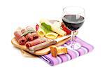 Red wine with cheese, prosciutto, bread, vegetables and spices. Isolated on white background