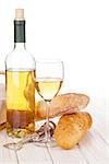 White wine and bread on white wooden table