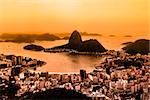 Rio de Janeiro, Brazil. Suggar Loaf and  Botafogo beach viewed from Corcovado at sunset. Rio de Janeiro is the 2016 summer olympic games hosting city.