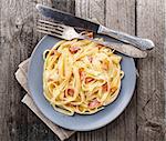 Pasta carbonara on a gray rustic background