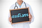 The word autism against doctor showing little blackboard