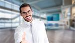 Happy businessman with glasses offering handshake against fitness studio