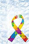 Autism awareness ribbon against crumpled white page