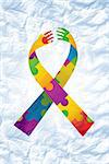 autism ribbon against crumpled white page