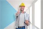 Architect showing thumbs up against modern blue and white room