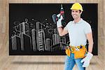 Carpenter holding cordless drill over white background against composite image of black card