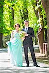 Bride and groom. Portrait of a loving wedding couple strolling in Tivoli park in Ljubljana, Slovenia.