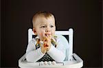 A 15 months baby boy on his high chair