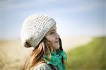 Portrait of a 7 years old girl, she is smiling on a country lane