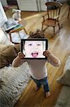 Little boy playing with a tablet