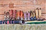 Six Pairs of Cowboy Boots on Blankets, Wyoming, USA