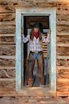 Portrait of Cowgirl in Doorway, Shell, Wyoming, USA