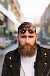 Portrait of bearded young man with sunglasses