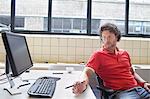 Man gazing at office desk