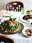 Still life with fattoush, vine leaves and flat breads