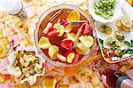 Still life of punch cocktail bowl with party snacks