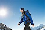 Man hiking in snow covered mountains, Jungfrauchjoch, Grindelwald, Switzerland