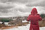 Backview of woman looking at landscape, Clent Hills, Worcestershire, UK