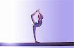 Young gymnast performing on balance beam