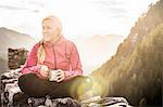 Young woman on top of Ehrenberg castle ruins, Reutte, Tyrol, Austria