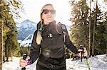 Young female hiker in snow covered forest, Reutte, Tyrol, Austria