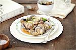 Still life of bowl of whole cooked clams