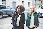 Two young female friends on street, Como, Italy