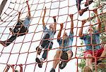 Team climbing net on boot camp course