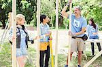 Volunteers talking at construction site