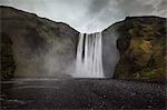 Waterfall over cliffs, Skogarfoss, Iceland