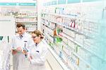 Pharmacists taking inventory in pharmacy
