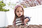 Girl gardening on patio