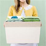 woman with a basket of folded clothes