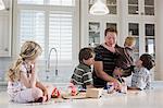 father and children in the kitchen