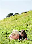 USA,California,San Francisco,Young couple lying on grass