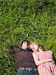 USA,California,San Francisco,Young couple napping on grass overhead view