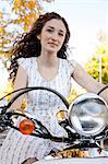 Young woman driving motorcycle