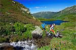 Hikers above the Middle Wildalmsee on the way to Schafsiedel, Kelchsau, Kitzbuhel Alps, Tyrol, Austria, Europe, MR