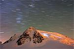 Europe, France, Haute Savoie, Rhone Alps, Chamonix, star trail and headlights on Mont Blanc