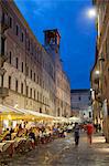 Outdoor restaurants on Corso Vannucci at dusk, Perugia, Umbria, Italy
