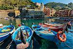 Moored fishing boats in the small port of Vernazza, Cinque Terre, Liguria, Italy