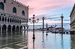 Italy, Veneto, Venice. Acqua Alta in St Marks square at sunrise