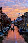 Europe, Italy, Veneto, Venice, Murano, Christmas decoration on a canal, sunset