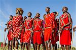 Africa, Kenya, Narok County, Masai Mara. Masai men dancing at their homestead