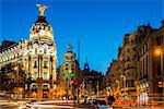 Night view of Gran Via street and Metropolis Building with car light trails, Madrid, Comunidad de Madrid, Spain