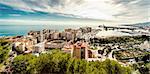 Picturesque view of Malaga bullring (La Malagueta) and seaport. Spain